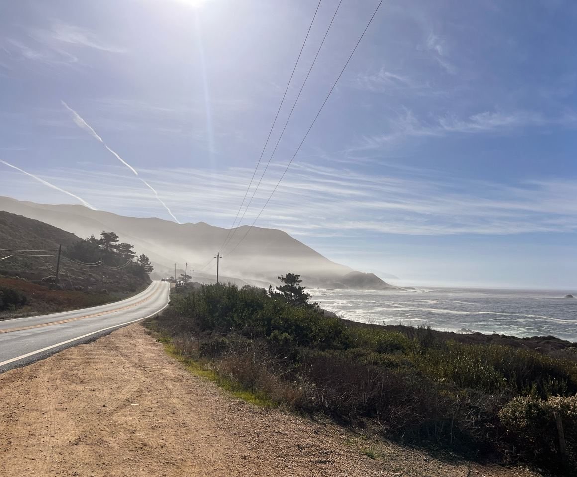 Eliot Fisher’s photograph of a winding road along the coast